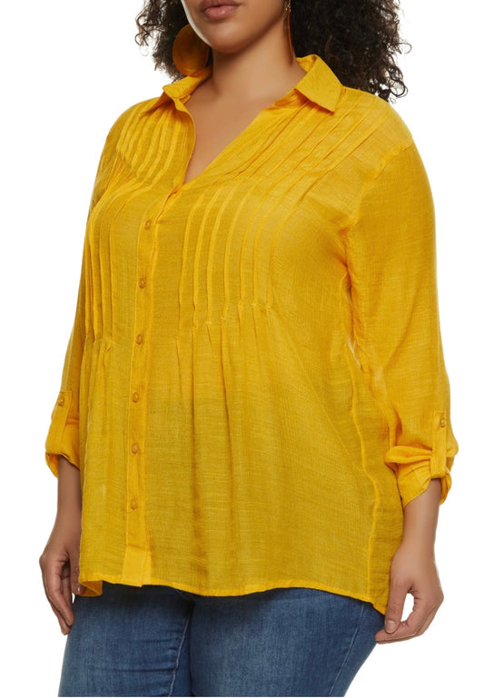 Expertly designed for style and comfort, our Pleated Button Blouse in Mustard is a must-have in your wardrobe. The button collar adds a touch of sophistication, while the roll down sleeves offer versatility. Making a statement has never been this easy.