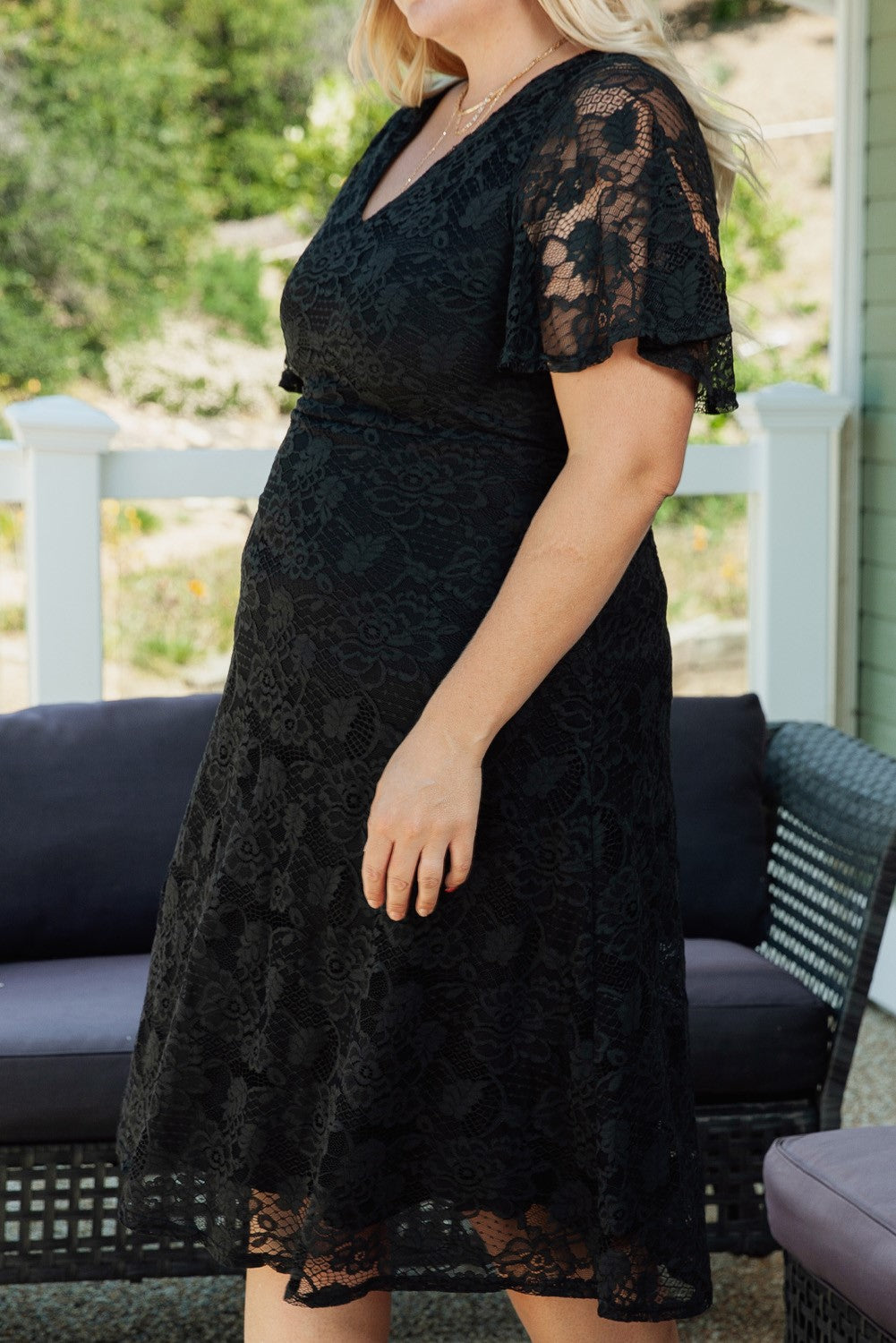side view black lace dress with flutter sleeve