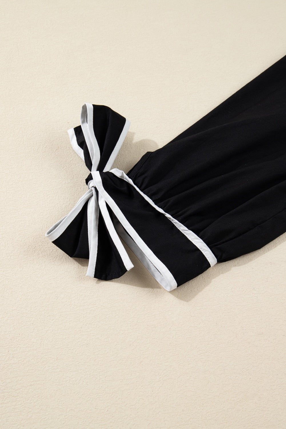 Classic Black Tiered Mini Dress with Tie Sleeve Detail – Effortless Chic Style