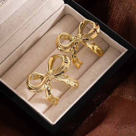 Gold Ribbon Bow Statement Earrings – Elegant Sculpted Metal Design