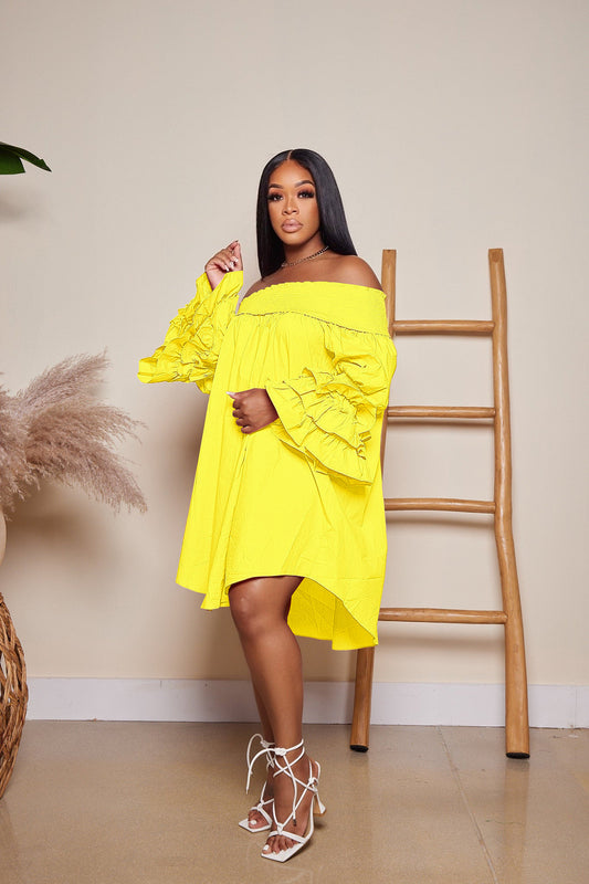 woman wearing Yellow off shoulder ruffle sleeve dress